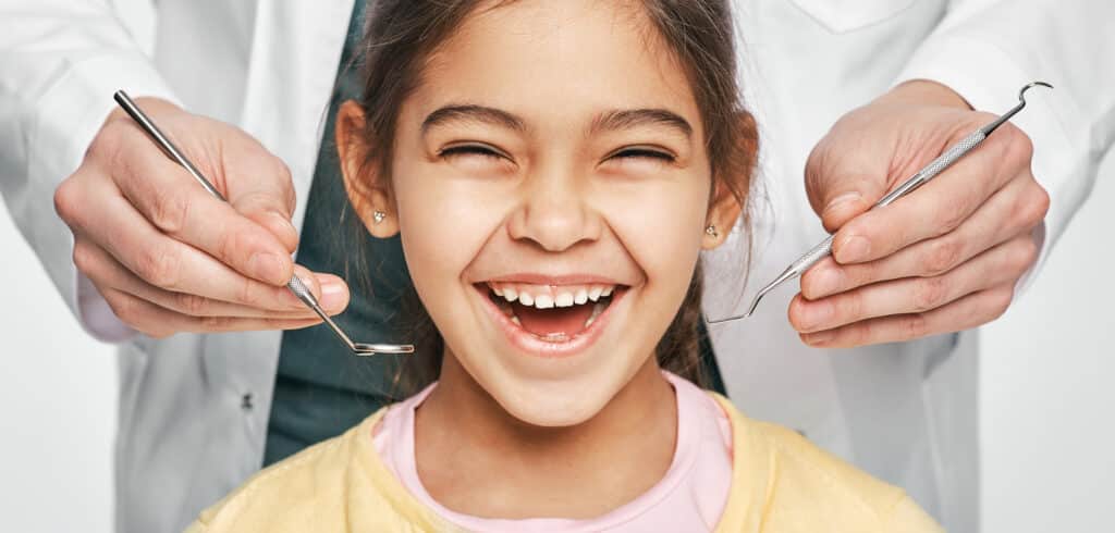 pediatric dental patient smiling with healthy teeth