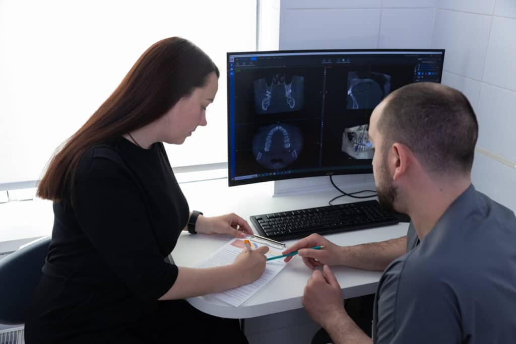 Patient discussing transferring dental records