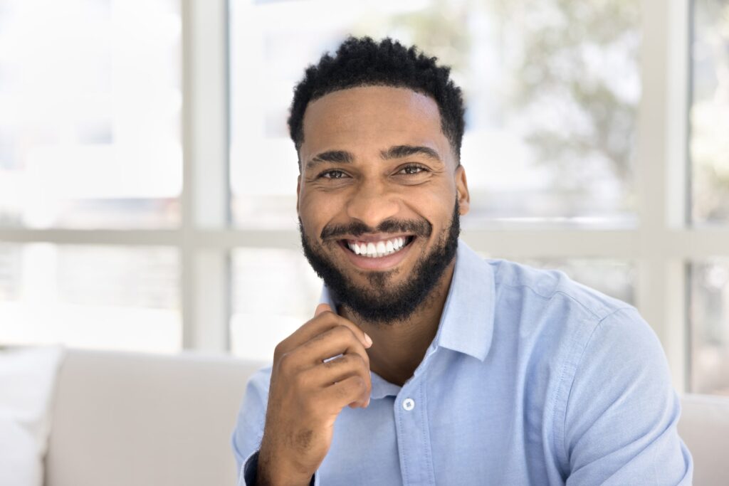 Smiling patient no longer with sensitive teeth