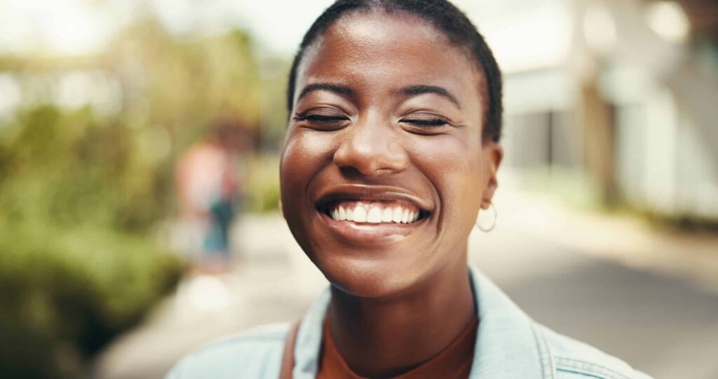 Patient having a bright smile after a teeth cleaning