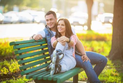 Young couple in a park on a bench